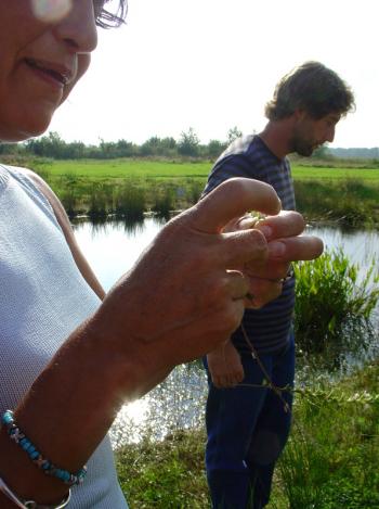 At pond's edge, Madeleine and Hans are moved to contemplation