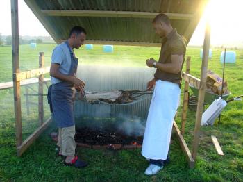 Chef Maher Al and assistant Artuur prepare to filet the beast