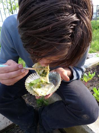 Illustrious guest eats ground elder ravioli with goutweed pesto at Slim Pickins restaurant opening, Debra Solomon, culiblog